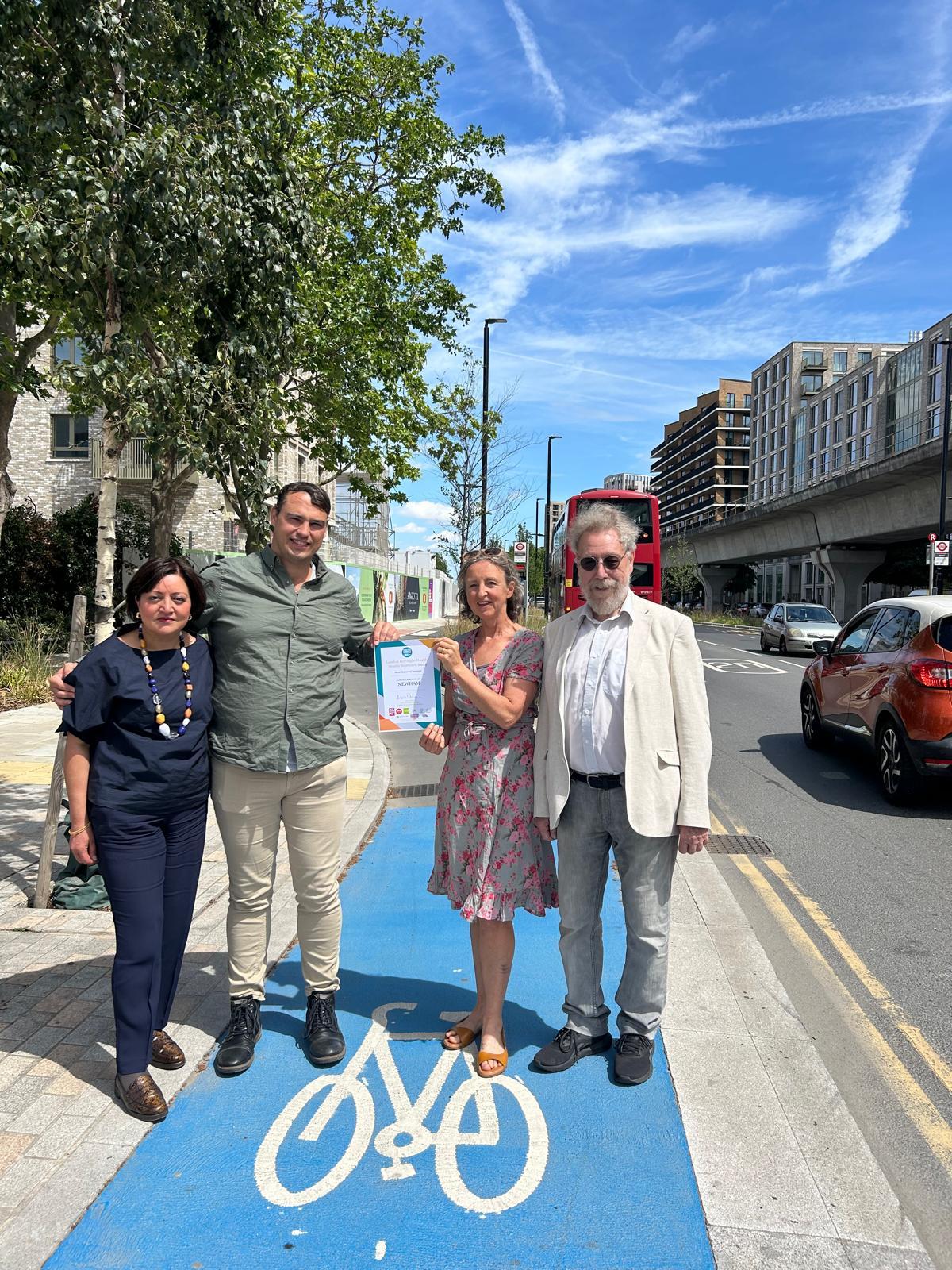 Group image standing on a cycling lane