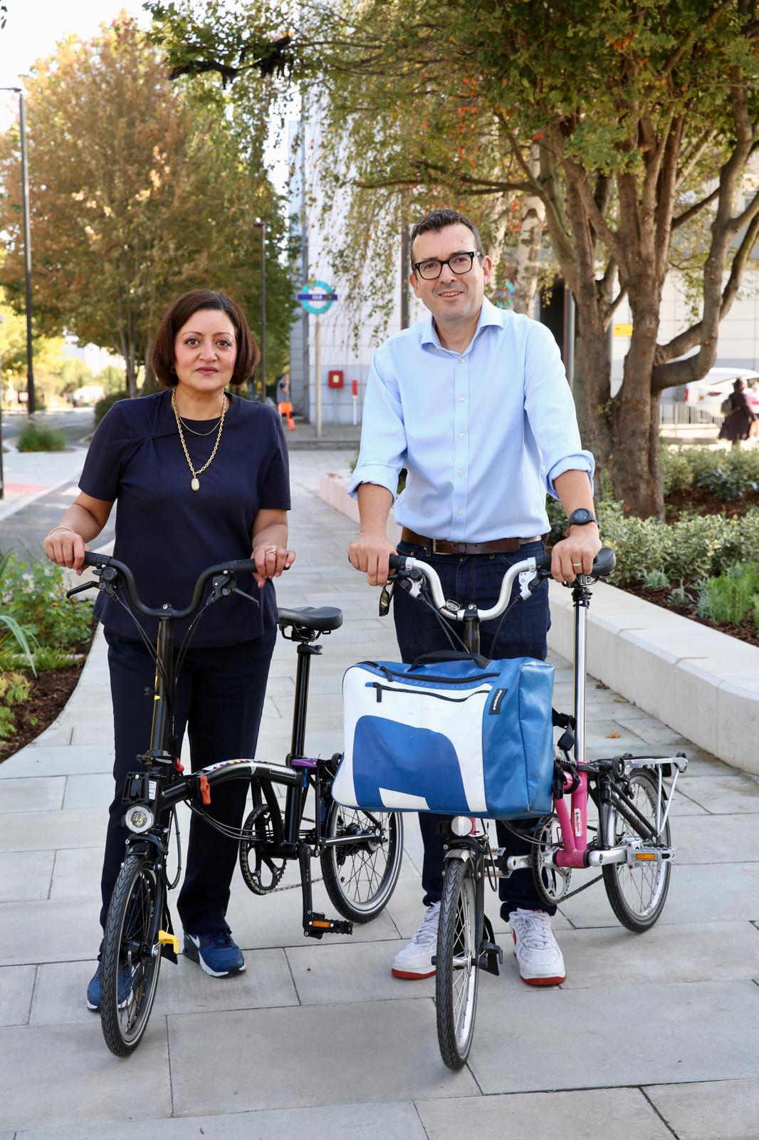 Mayor standing beside bike