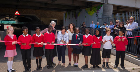 Mayor Rokhsana Fiaz and pupils from Star Primary School cut the ribbon to unveil a new work of art