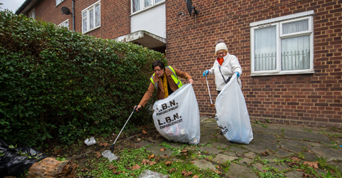 Mayor of Newham and a woman picking up rubbish
