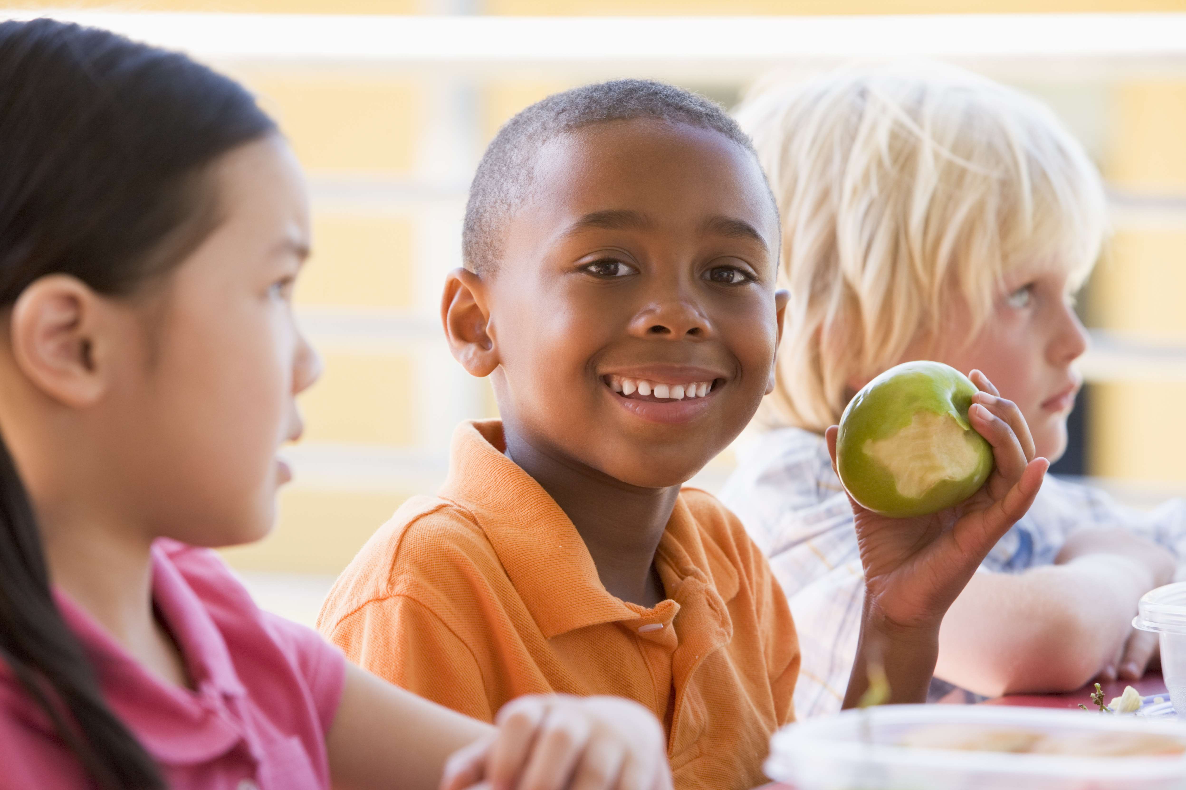 Three children eating lunch