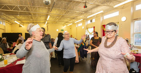 Elderly residents dancing at a Christmas Lunch