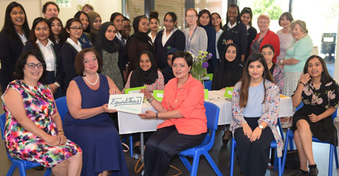 Pupils past and present sat with female governors, and staff at Plashet School with new Mayor Rokhsana Fiaz
