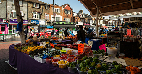Trading at Fruit and vegetable stall at Queens Market, Upton Park.