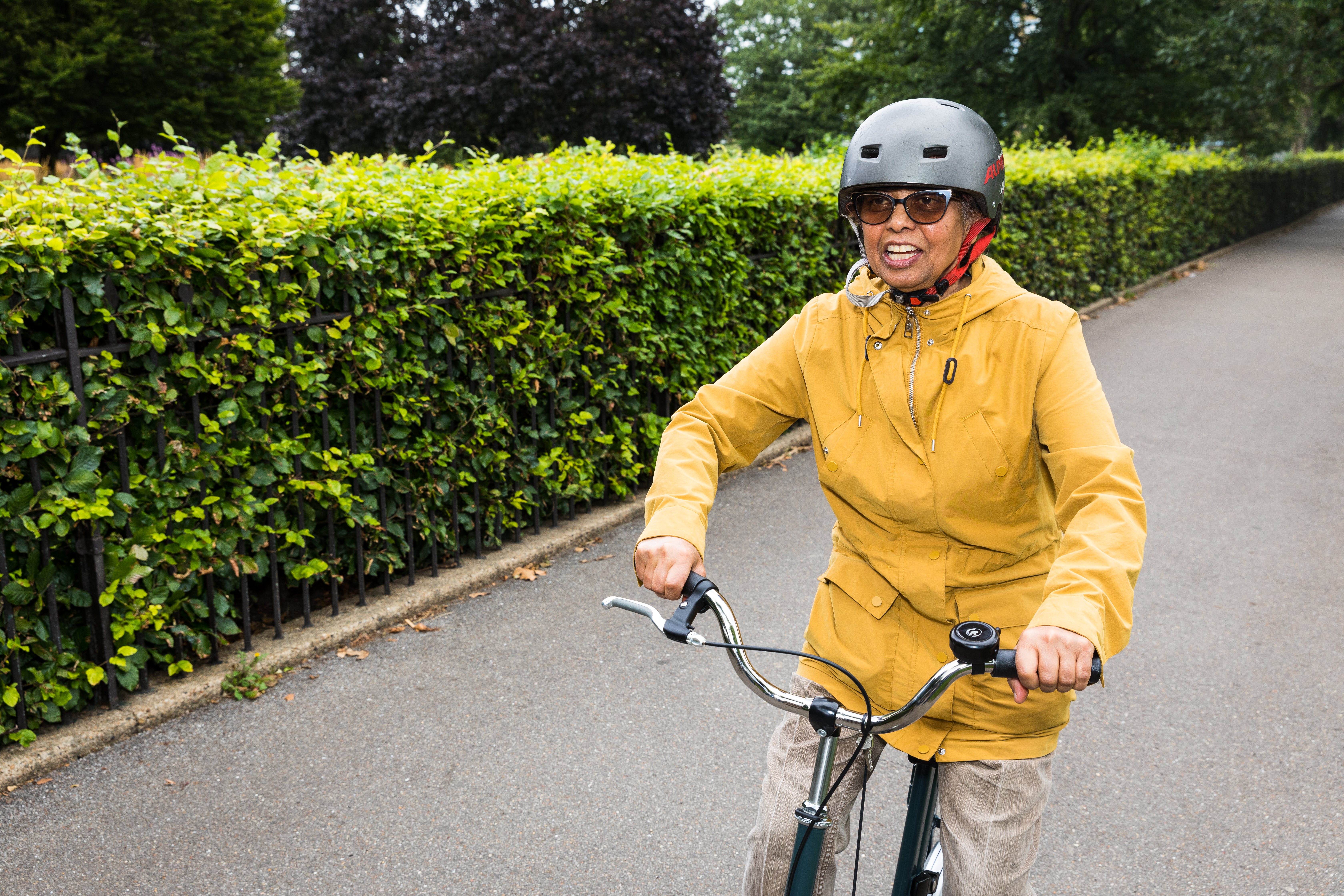 health, lady in a yellow raincoat, lady riding bike